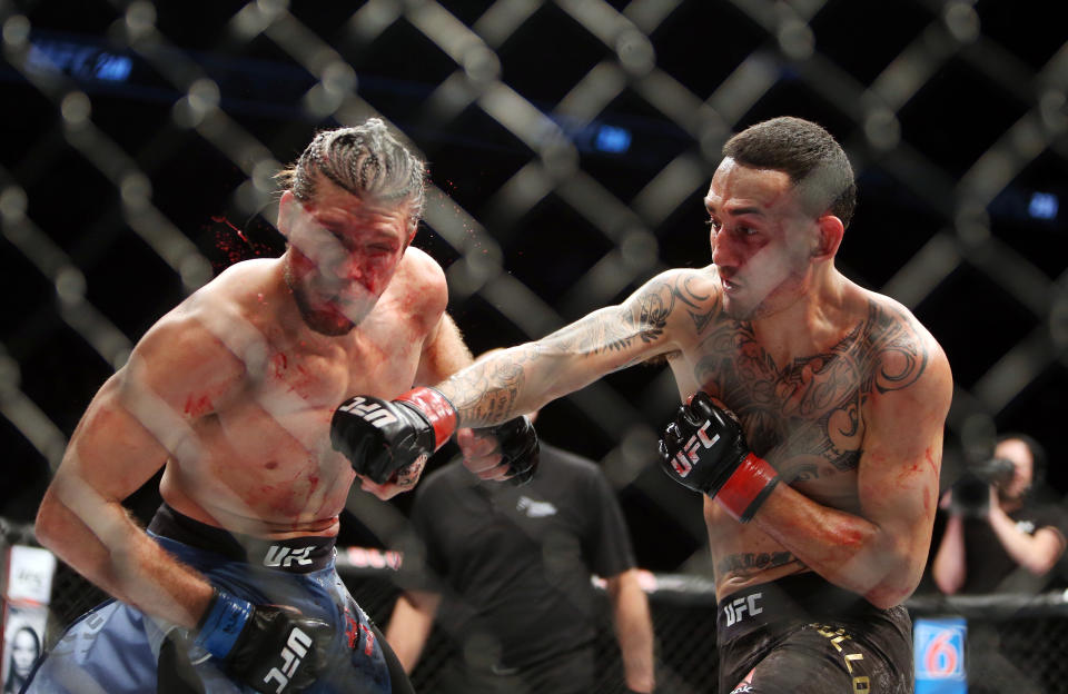 TORONTO, ON - DECEMBER 8:  Max Holloway (R) of the United States fights against Brian Ortega of the United States in a featherweight bout during the UFC 231 event at Scotiabank Arena on December 8, 2018 in Toronto, Canada.  (Photo by Vaughn Ridley/Getty Images)