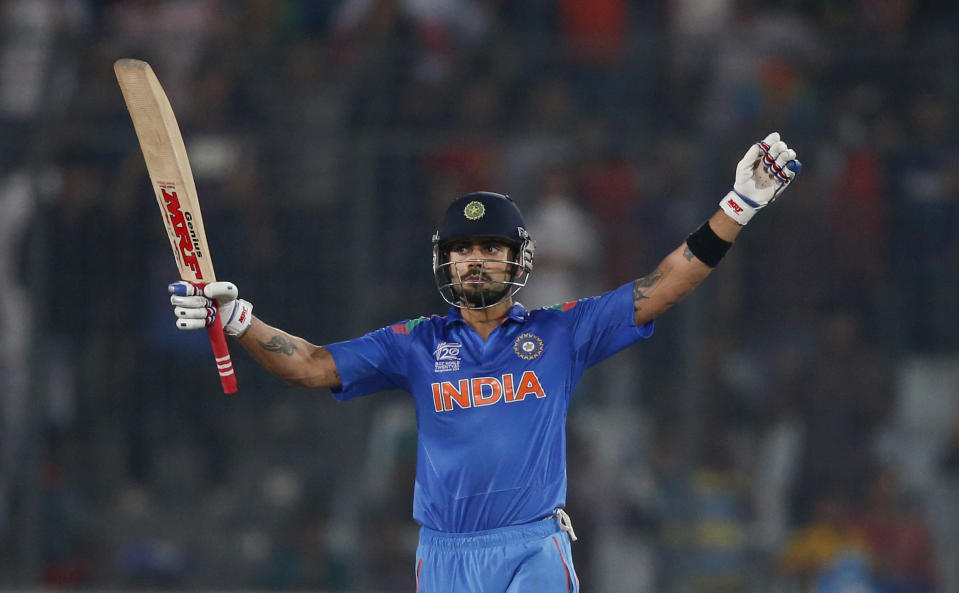 India's Virat Kohli celebrates their win over South Africa in the ICC Twenty20 Cricket World Cup semi-final match in Dhaka, Bangladesh, Friday, April 4, 2014. India won the match by six wickets. (AP Photo/Aijaz Rahi)