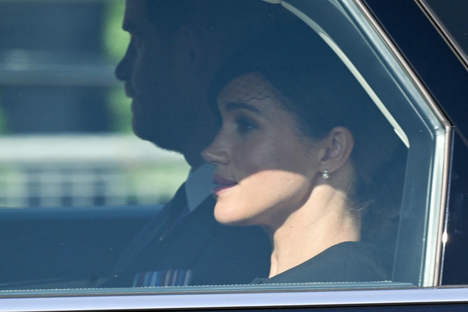 The Duke and Duchess of Sussex depart after the procession for the lying in state of Queen Elizabeth II. (Getty Images)