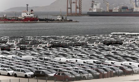 Vehicles are parked at a cargo terminal at Piraeus port