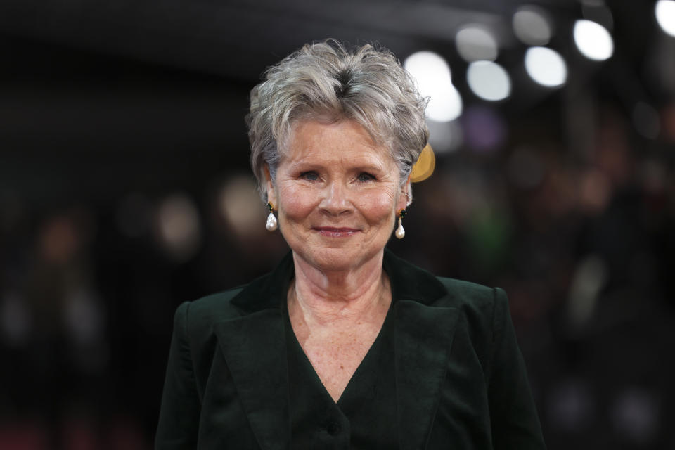 FILE - Imelda Staunton poses for photographers upon arrival at the premiere for 'The Crown' season 6 finale, in London, Tuesday, Dec. 5, 2023. Staunton is among more than 1,000 people, including artist Tracey Emin, and Duran Duran singer Simon Le Bon, recognized Friday June 14, 2024 on the King’s Birthday Honors list, released to mark the British monarch’s official birthday. (Photo by Vianney Le Caer/Invision/AP, File)