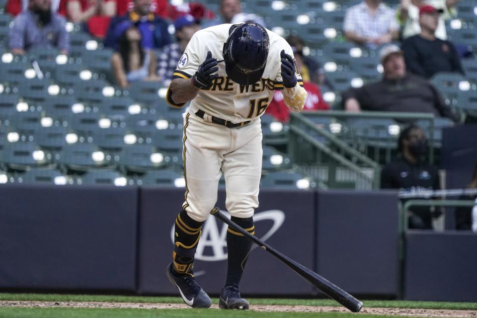 Milwaukee Brewers' Kolten Wong reacts after flying out during the seventh inning of a baseball game Thursday, May 13, 2021, in Milwaukee. (AP Photo/Morry Gash)