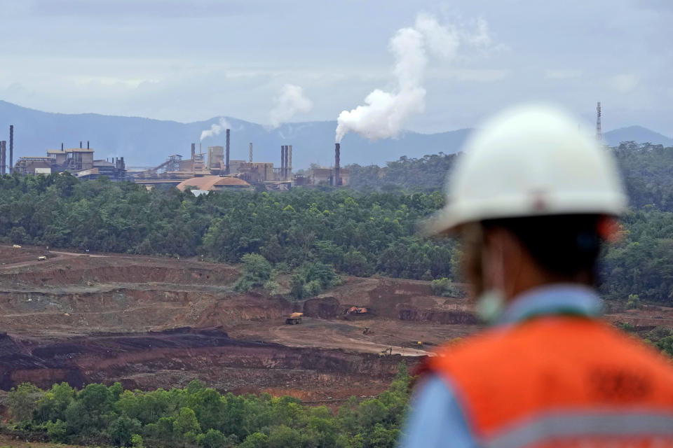 Steam rise from PT Vale Indonesia's nickel processing plant in Sorowako, South Sulawesi, Indonesia, Tuesday, Sept. 12, 2023. A presidential election in Indonesia, the world's third-largest democracy, is highlighting the choices to be made as the country seeks to exploit its rich reserves of nickel and other resources that are vital to the global transition away from fossil fuels. (AP Photo/Dita Alangkara)