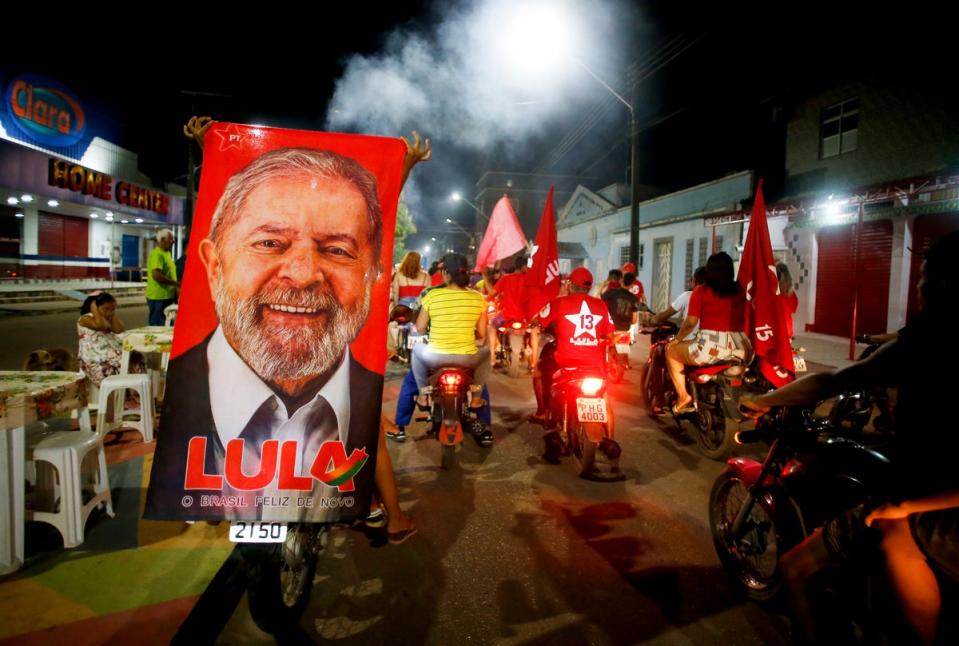 Lula supporters celebrate in the wake of Brazil’s election result (AP)