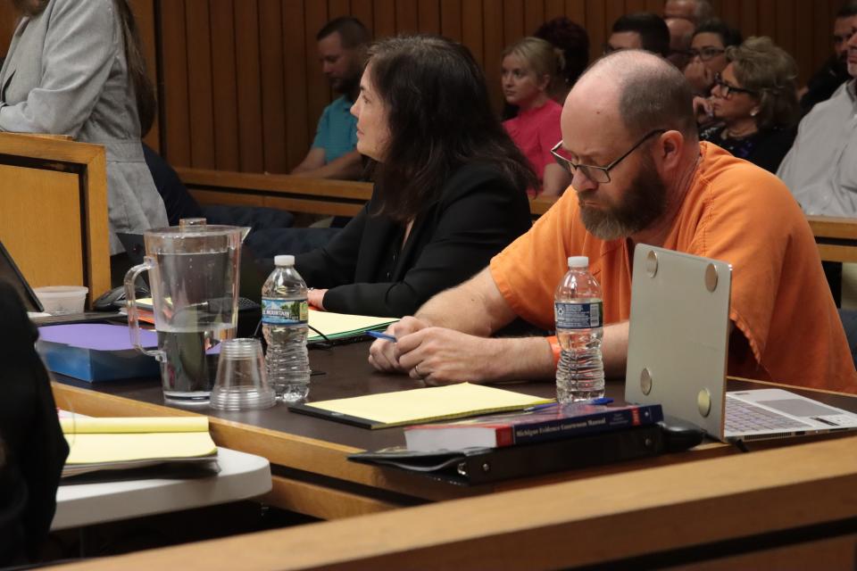 Dale Warner, right, listens to testimony Friday, May 3, 2024, in Lenawee County District Court. This was the third day of a preliminary interaction into the murder and evidence tampering charges against Warner in the disappearance of his wife, Dee.