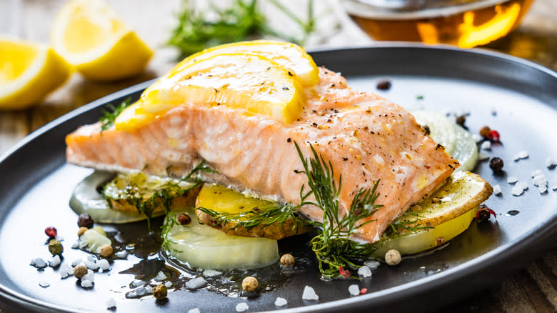 salmon on a bed of roasted lemons