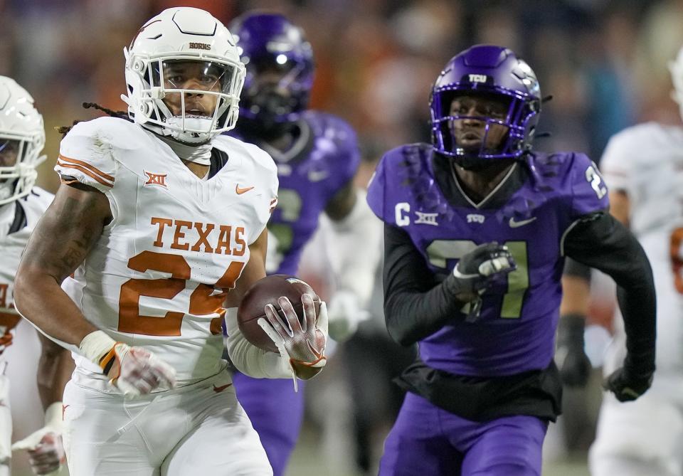 Texas Longhorns running back Jonathon Brooks (24) runs for the first down against TCU Horned Frogs in the first quarter of an NCAA college football game, Saturday, November. 11, 2023, at Amon G. Carter Stadium in Fort Worth, Texas.