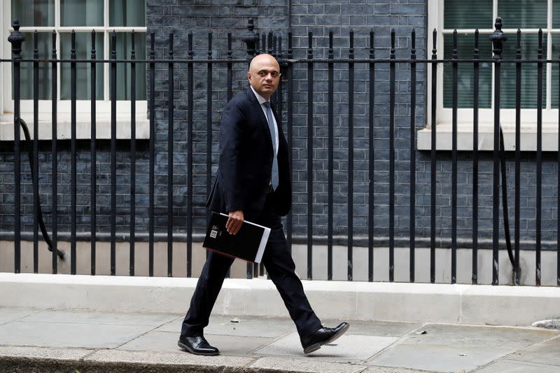 FILE PHOTO: Britain's Health Secretary Sajid Javid walks on Downing Street in London