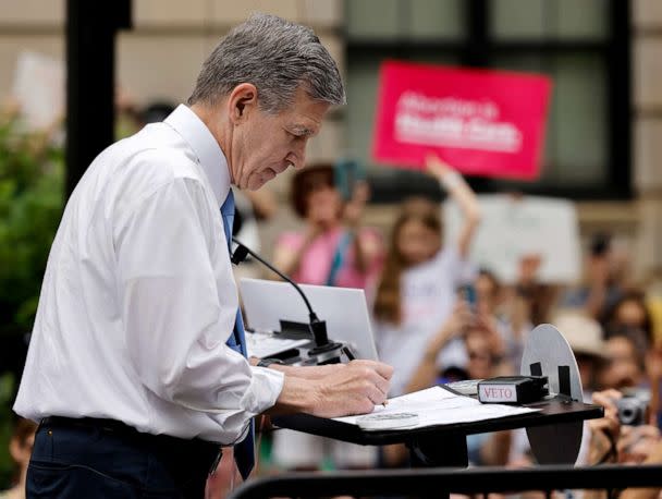 PHOTO: North Carolina Governor Roy Cooper vetoes the SB20 legislation limiting most abortions to the first trimester of pregnancy, a sharp drop from the state&#39;s current limit of 20 weeks gestation, in Raleigh, N.C., on May 13, 2023. (Jonathan Drake/Reuters)