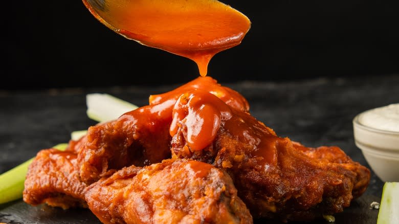 Sauce dripping on chicken wings