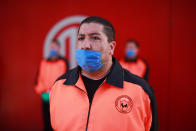 Security personnel wear medical face masks before the 10th round match between Toluca and Atlas as part of the Torneo Clausura 2020 Liga MX at Nemesio Diez Stadium on March 15, 2020 in Toluca, Mexico. The match is played behind closed doors to prevent the spread of the novel Coronavirus (COVID-19). (Photo by Hector Vivas/Getty Images)