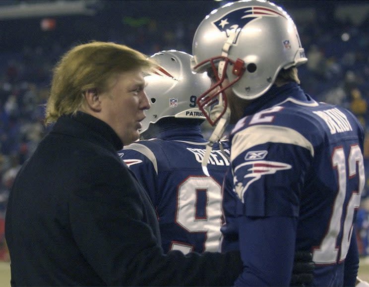 Donald Trump talks to Tom Brady before a game in 2004. (AP)