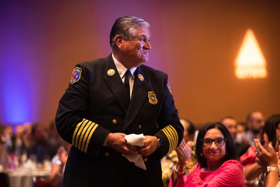 Fire Chief Robert Rocha stands while being recognized by Mayor Paulette Guajardo at the State of the City Address at the American Bank Center in Corpus Christi, Texas on August 4, 2022.