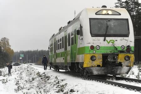 Passenger train near the railroad crossing is pictured after a crash in Raasepori, Southern Finland, October 26, 2017. LEHTIKUVA/Markku Ulander/via REUTERS