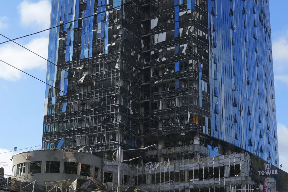 A damaged tower block at the scene of Russian shelling in Kyiv, Ukraine, Monday, Oct. 10, 2022. Two explosions rocked Kyiv early Monday following months of relative calm in the Ukrainian capital. (AP Photo/Efrem Lukatsky)