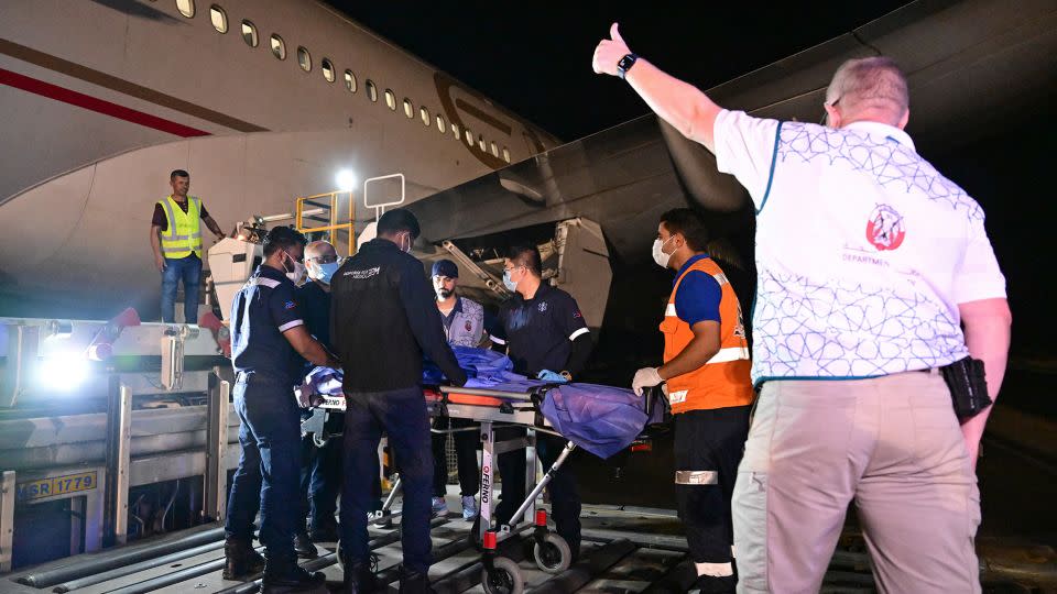 An injured Palestinian evacuated from the Gaza Strip is transported to an Emirati aircraft at Egypt's Arish airport, to receive treatment in the United Arab Emirates, on July 5. - Giuseppe Cacace/AFP/Getty Images