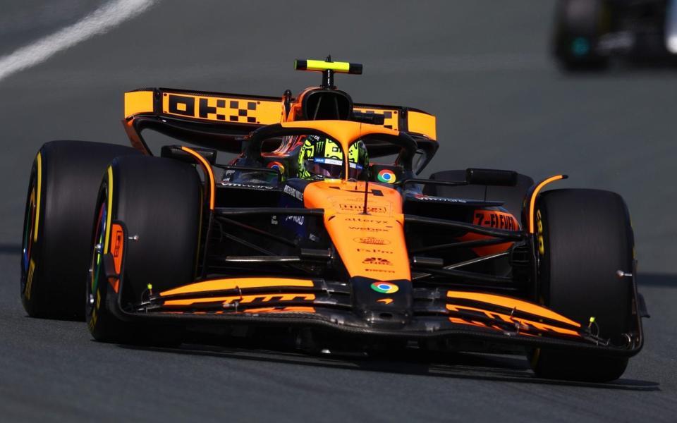 Lando Norris of Great Britain driving the (4) McLaren MCL38 Mercedes leads George Russell of Great Britain driving the (63) Mercedes AMG Petronas F1 Team W15 during the F1 Grand Prix of Netherlands at Circuit Zandvoort on August 25, 2024 in