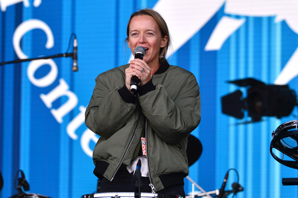 GLASTONBURY, ENGLAND - JUNE 25: Emily Eavis speaks on the Pyramid stage during day four of Glastonbury Festival at Worthy Farm, Pilton on June 25, 2022 in Glastonbury, England. The 50th anniversary of Glastonbury’s inaugural event in 1970 was postponed twice after two cancelled events, in 2020 and 2021, due to the Covid pandemic. The festival, founded by farmer Michael Eavis, is the largest greenfield music and performing arts festival in the world. (Photo by Jim Dyson/Getty Images)