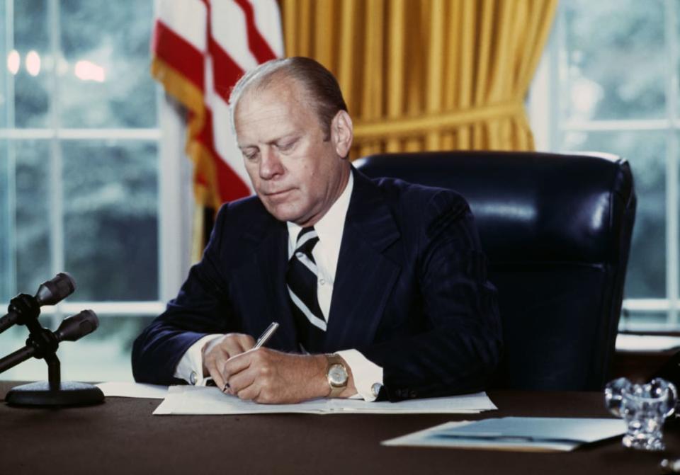 <div class="inline-image__caption"><p>US President Gerald Ford signs a document granting former President Richard Nixon a full pardon, at the White House in Washington on Sept. 8, 1974. </p></div> <div class="inline-image__credit">UPI/Bettmann Archive/Getty Images</div>