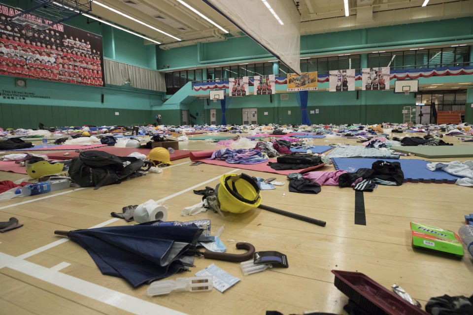 In this Friday, Nov. 22, 2019, photo, belongings of anti-government protesters are left at a gymnasium at the Hong Kong Polytechnic University campus in Hong Kong. Most of the protesters who took over the university have left following clashes with police, but an unknown number have remained inside, hoping somehow to avoid arrest. (AP Photo/Vincent Thian)