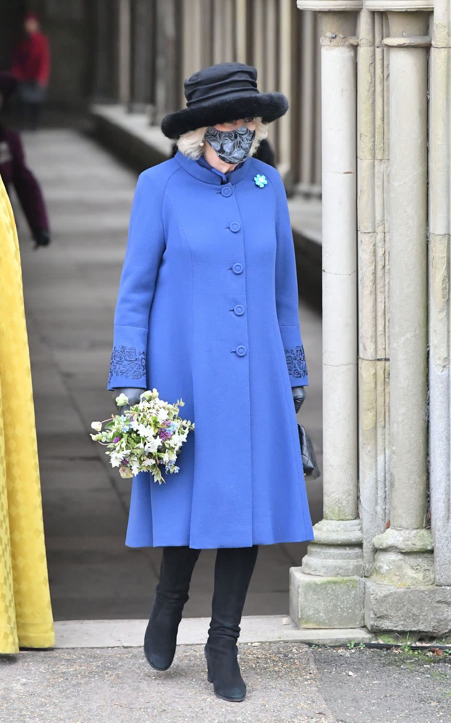 <p>The Duchess of Cornwall sported a blue coat with floral-embroidered cuffs, black boots, and a black fur-trimmed hat while attending a celebration of Salisbury Cathedral’s 800th anniversary.</p>