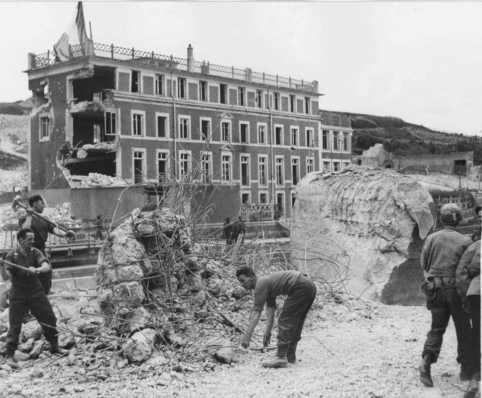 FILE - British Royal Engineers break down concrete emplacements of the German West Wall in Port en Bassin in France on June 22, 1944. Port en Bassin was the first port to be captured in Normandy after the Allied landing, on June 6, 1944. (AP Photo, File)