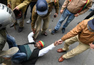 LUCKNOW, INDIA - DECEMBER 18: Pragatisheel Samajwadi Party (Lohiya) workers detained by police after a lathi charge while demonstrating outside the party office to Save Constitution, Save India, at Mall Avenue on December 18, 2019 in Lucknow, India. (Photo by Dheeraj Dhawan/Hindustan Times via Getty Images)