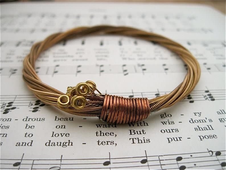 <p><strong>foxdesignsjewelry</strong></p><p>etsy.com</p><p><strong>$30.00</strong></p><p>With this string bracelet, guitar players will never have to fully part from their instruments. Suitable for both men and women, it's a unique jewelry piece that's subtle enough for everyday wear. </p>