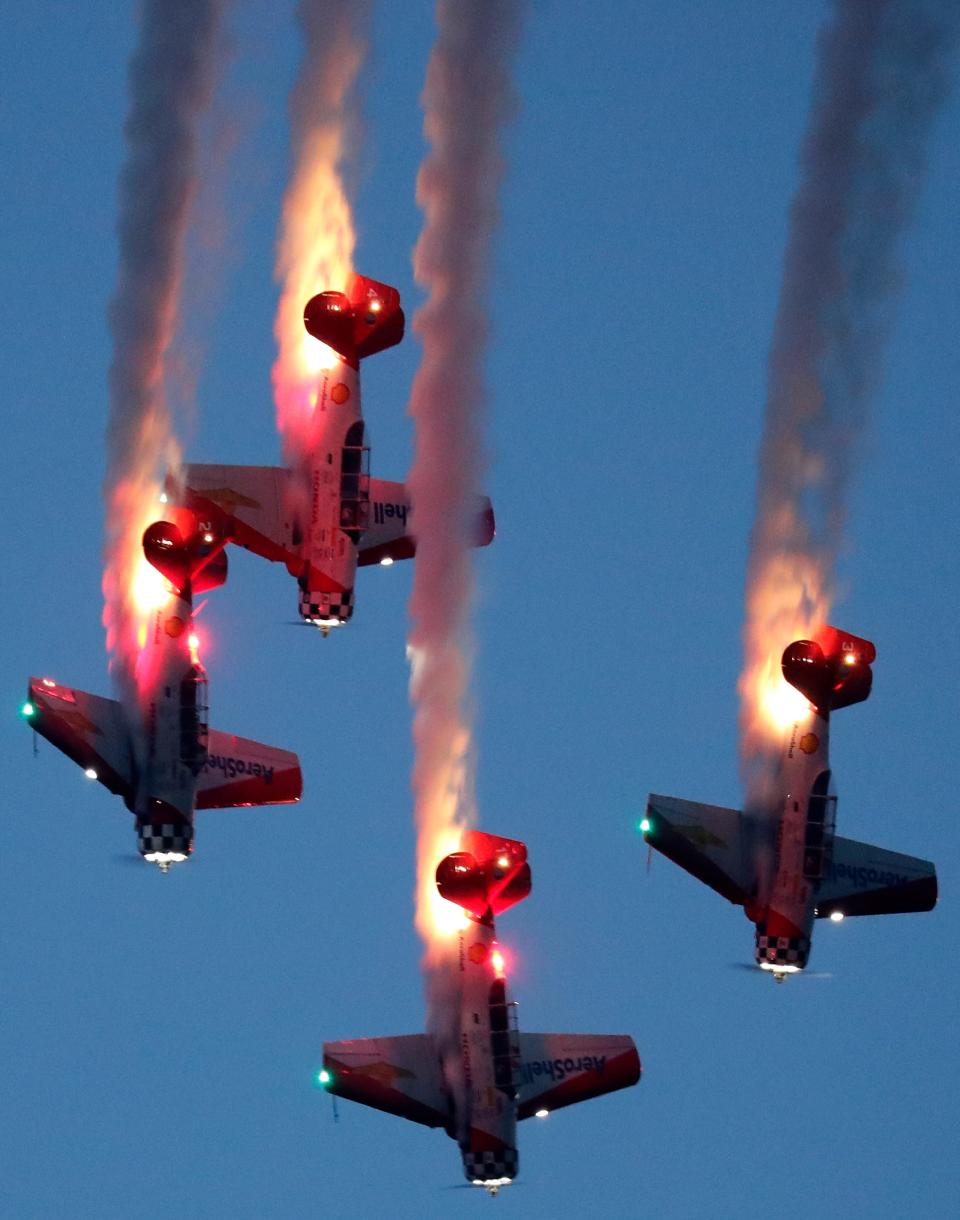 Pilots perform in an air show at the Experimental Aircraft Association AirVenture on July 29, 2021, at Wittman Regional Airport in Oshkosh.