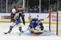 St. Louis Blues goaltender Jordan Binnington (50) stops Colorado Avalanche's Joonas Donskoi (72) from shooting during the third period in Game 3 of an NHL hockey Stanley Cup first-round playoff series Friday, May 21, 2021, in St. Louis. (AP Photo/Scott Kane)