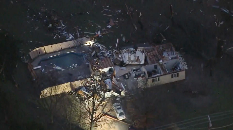 A structure is damaged after a tornado touched down in Wayne, Okla., early Tuesday, Dec. 13, 2022. Millions of people in the central United States from the Rocky Mountains to the Midwest are bracing for blizzard-like conditions from a massive storm blowing across the country. States farther to the south, including Texas and Oklahoma, saw tornadoes early Tuesday, with some damage reported in Oklahoma. (KOCO via AP)