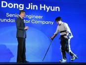 <p>Hyundai Motor Co. Vice President Mike O’Brien (L) looks on as Hyundai Motor Co. senior engineer Dr. Dong Jin Hyun demonstrates the H-Mex Hyundai Medical Exoskeleton, which is used to assist people who have trouble walking, during a press event for CES 2017 at the Mandalay Bay Convention Center on January 4, 2017. (Getty Images) </p>