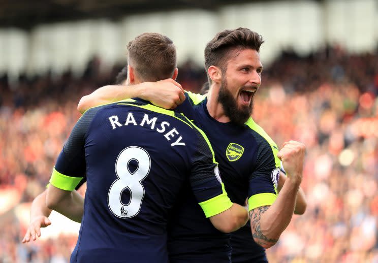 Olivier Giroud of Arsenal celebrates scoring his sides fourth goal with Aaron Ramsey of Arsenal during the Premier League match between Stoke City and Arsenal at Bet365 Stadium