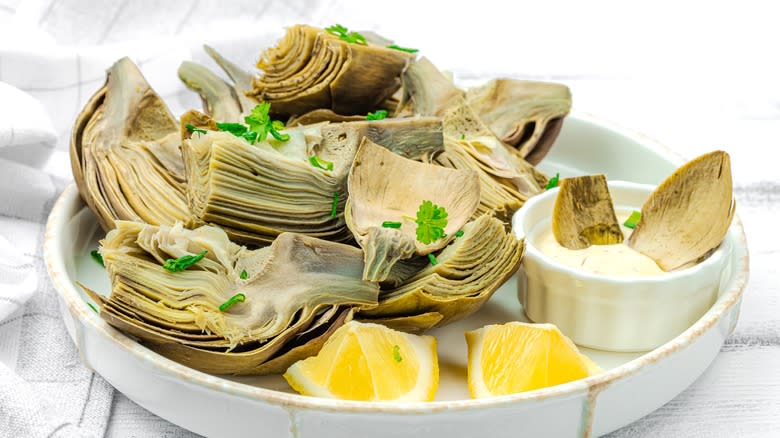 artichokes served with lemon