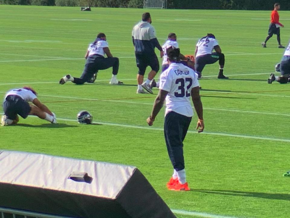 Running back Chris Carson (32) again not participating in practice because of a neck condition, four days before the Seahawks without Russell Wilson play the Steelers in Pittsburgh.