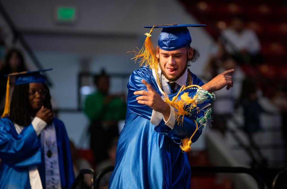 Timothy Owen Gooding dances across the stage as he celebrates receiving his diploma during the 2022 Mulberry High School Graduation Ceremony at the RP Funding Center in Lakeland Fl. Thursday May 19,  2022.  ERNST PETERS/ THE LEDGER