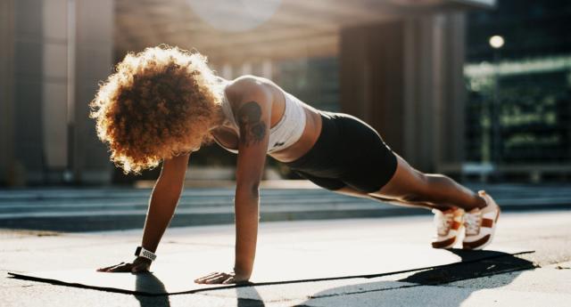 Woman Standing Doing Side Stretch High-Res Stock Photo - Getty Images