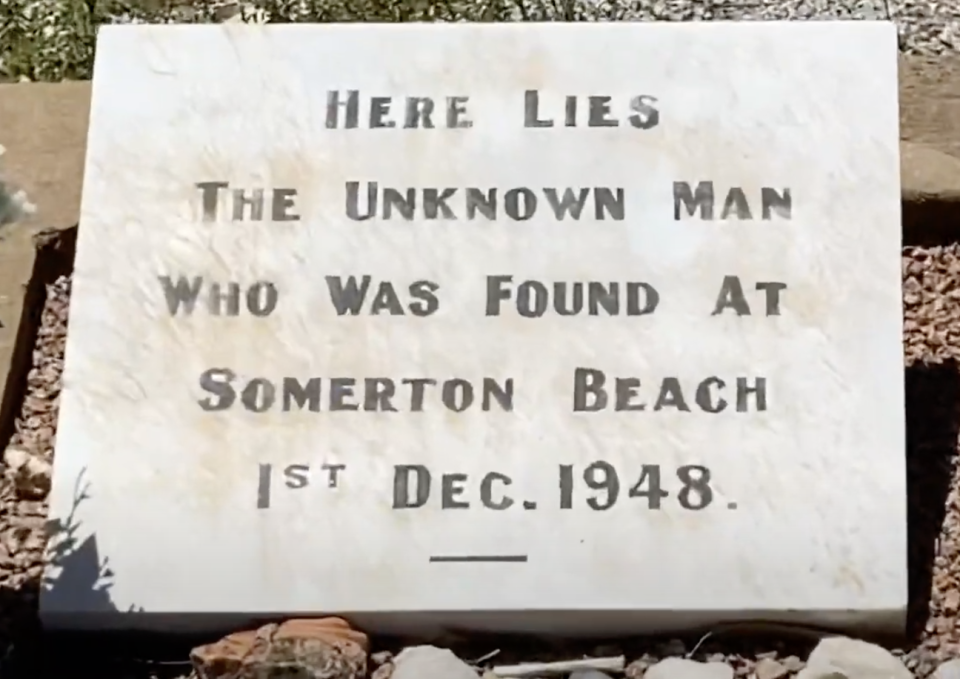 A gravestone reads: "Here lies the unknown man who was found at Somerton Beach 1st Dec. 1948."