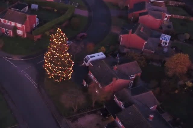 Britain's darkest village with no street lights becomes illuminated for Christmas after a couple decorate their old tree which grew to 52ft after planting it in 1978