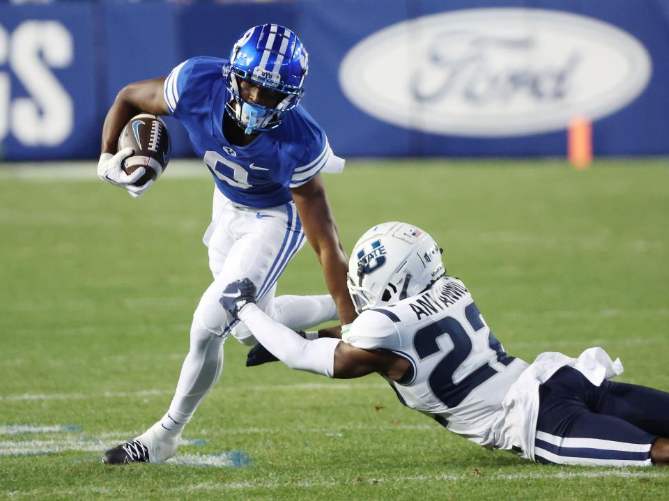 BYU receiver Kody Epps fights for yardage during a game against Utah State in Provo on Thursday, Sept. 29, 2022.