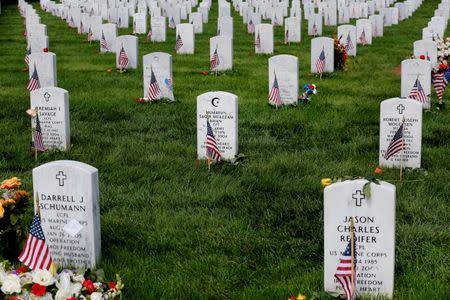 The grave marker of U.S. Army Captain Humayun Khan stands with the symbol of Islam on it amongst other grave markers inside of Section 60 in Arlington National Cemetery on Memorial Day, May 30, 2016. REUTERS/Lucas Jackson