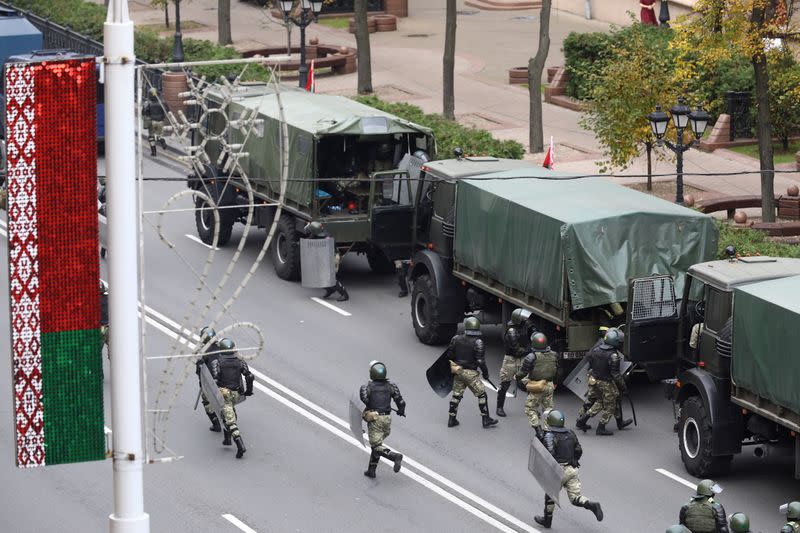 Belarusian law enforcement officers are seen during an opposition rally in Minsk