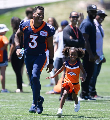 <p>Andy Cross/MediaNews Group/The Denver Post via Getty</p> Russell Wilson and his daughter, Sienna