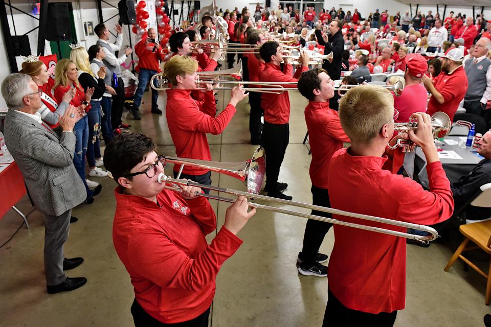 Two columns of marching band members entertained nearly 400 fans Monday during the Buckeye Bash for Richland County Alumni.