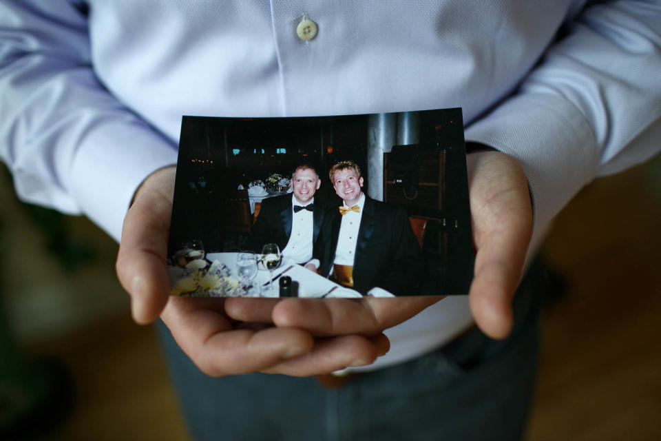 Jim Obergefell holds a photo of him and his late husband John Arthur in his condo (Maddie McGarvey / The Washington Post via Getty Images)