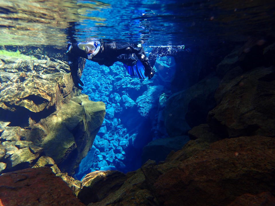 Snorkel between two tectonic plates at Silfra in Iceland.