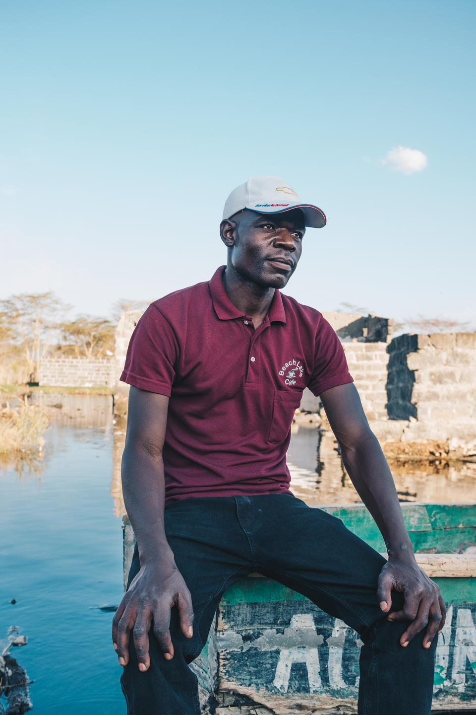 Gerrard Otieno sits on a boat in what used to be his living room. He is among hundreds of people displaced by Lake Nakuru's rising waters.<span class="copyright">Khadija M. Farah for TIME</span>