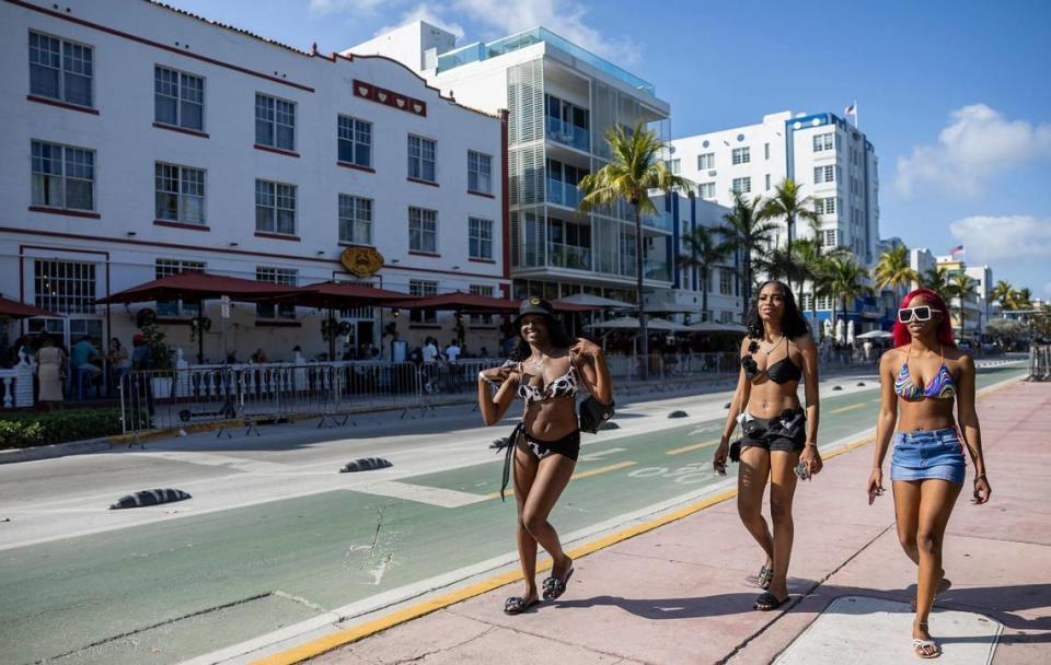 Girls make their way down Ocean Drive during spring break on Friday, March 15, 2024, in Miami Beach. 