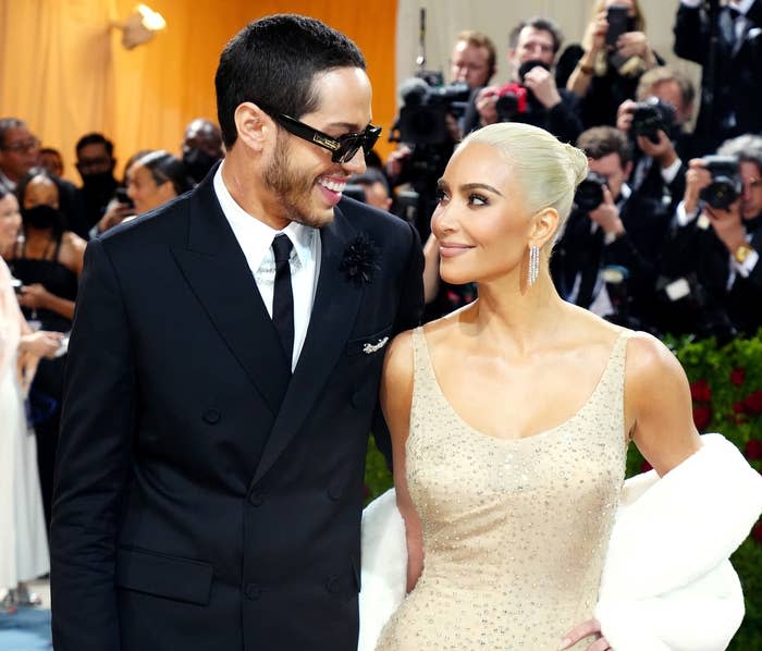 pete and kim looking at each other at the met gala