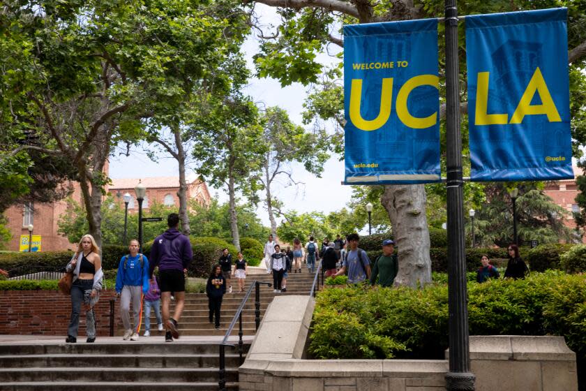 Los Angeles, CA - May 17: Signage and people along Bruin Walk East, on the UCLA Campus in Los Angeles, CA, Wednesday, May 17, 2023. (Jay L. Clendenin / Los Angeles Times)